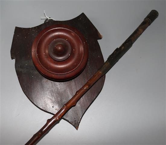 A Victorian holly coaching whip press button holder